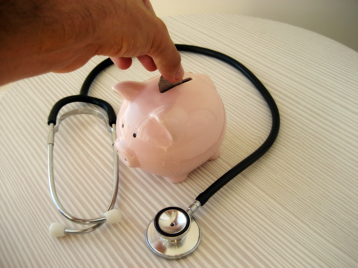 Stethoscope and piggy Bank