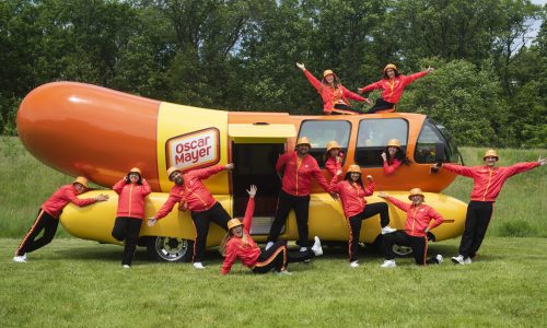 Hotdoggers pose in front of Wienermobile