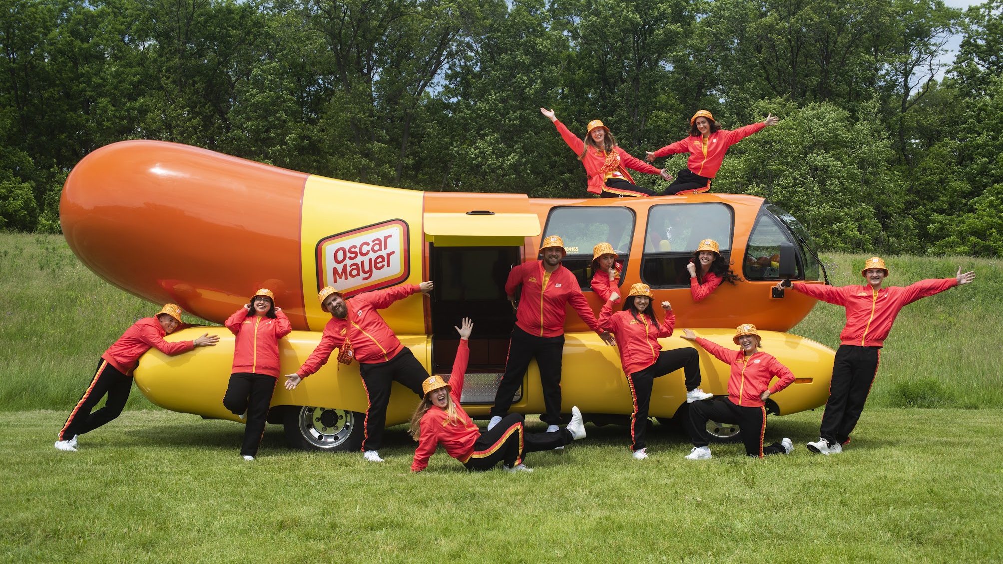 Hotdoggers pose in front of Wienermobile