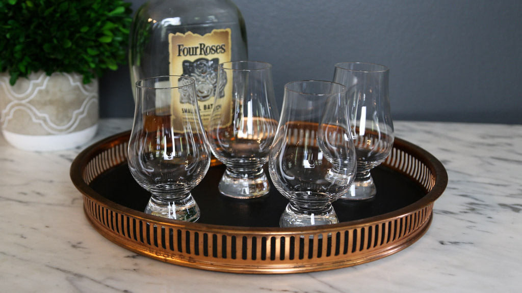 https://www.dontwasteyourmoney.com/wp-content/uploads/2020/05/whiskey-glasses-glencairn-4-set-tray-review-ub-1.jpg