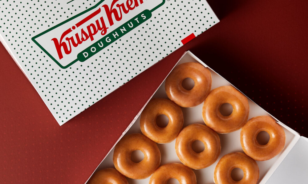 A dozen Krispy Kreme original glazed donuts in box
