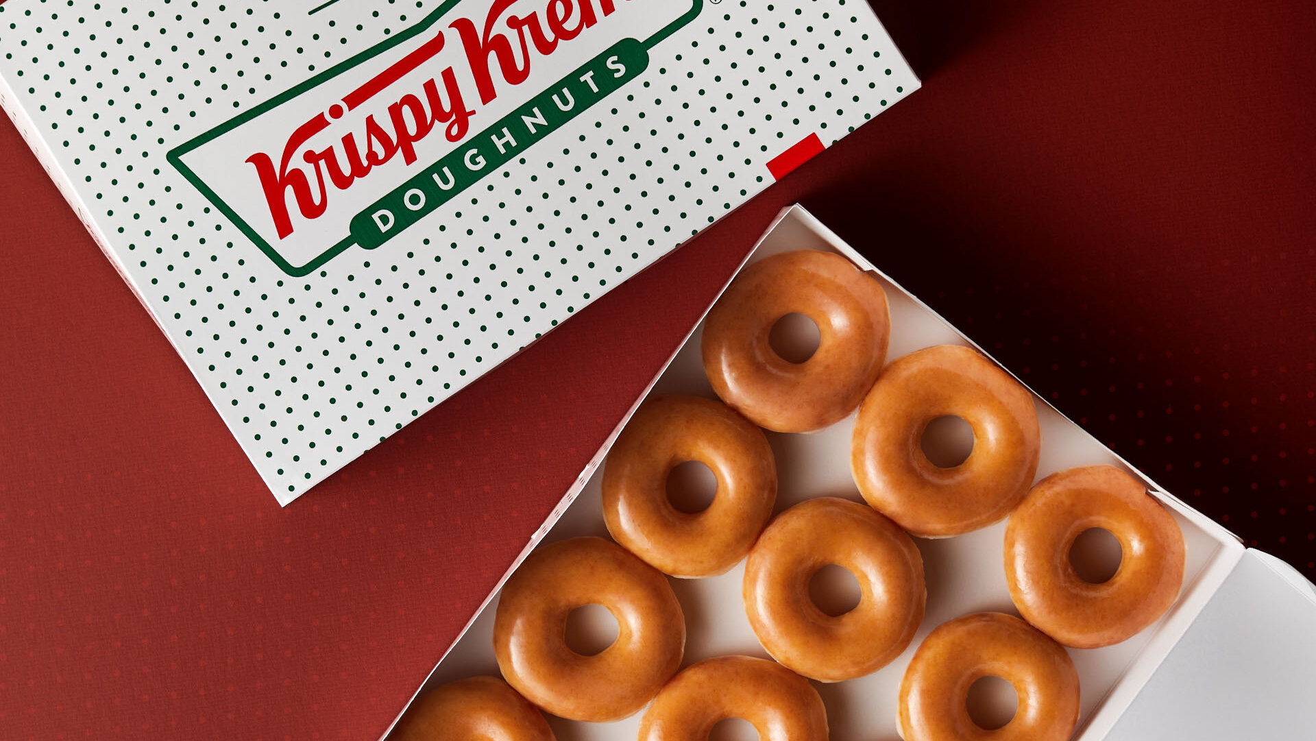 A dozen Krispy Kreme original glazed donuts in box