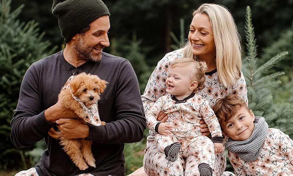 family and dog in matching xmas pajamas
