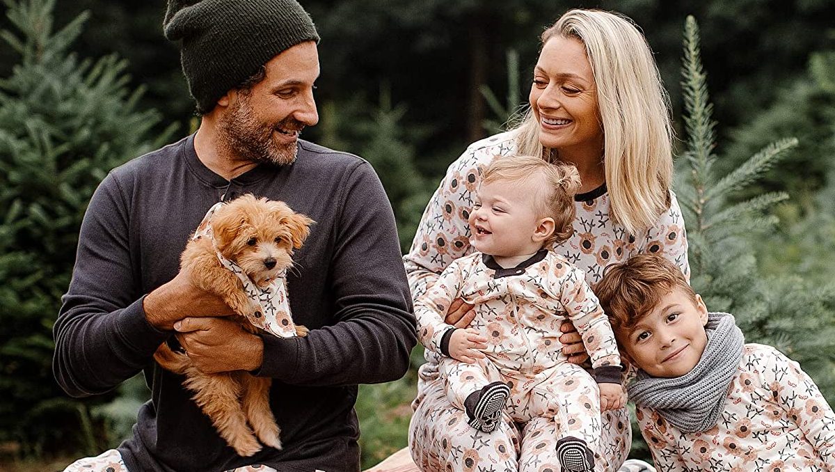 family and dog in matching xmas pajamas
