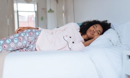 Woman napping in pajamas