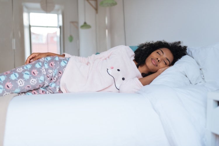 Woman napping in pajamas