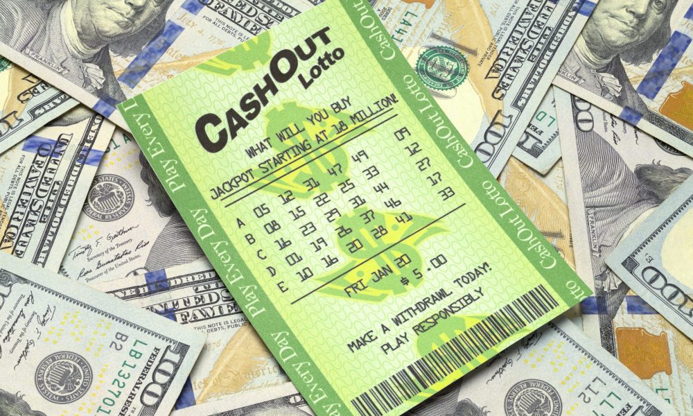 Lottery ticket on cash pile