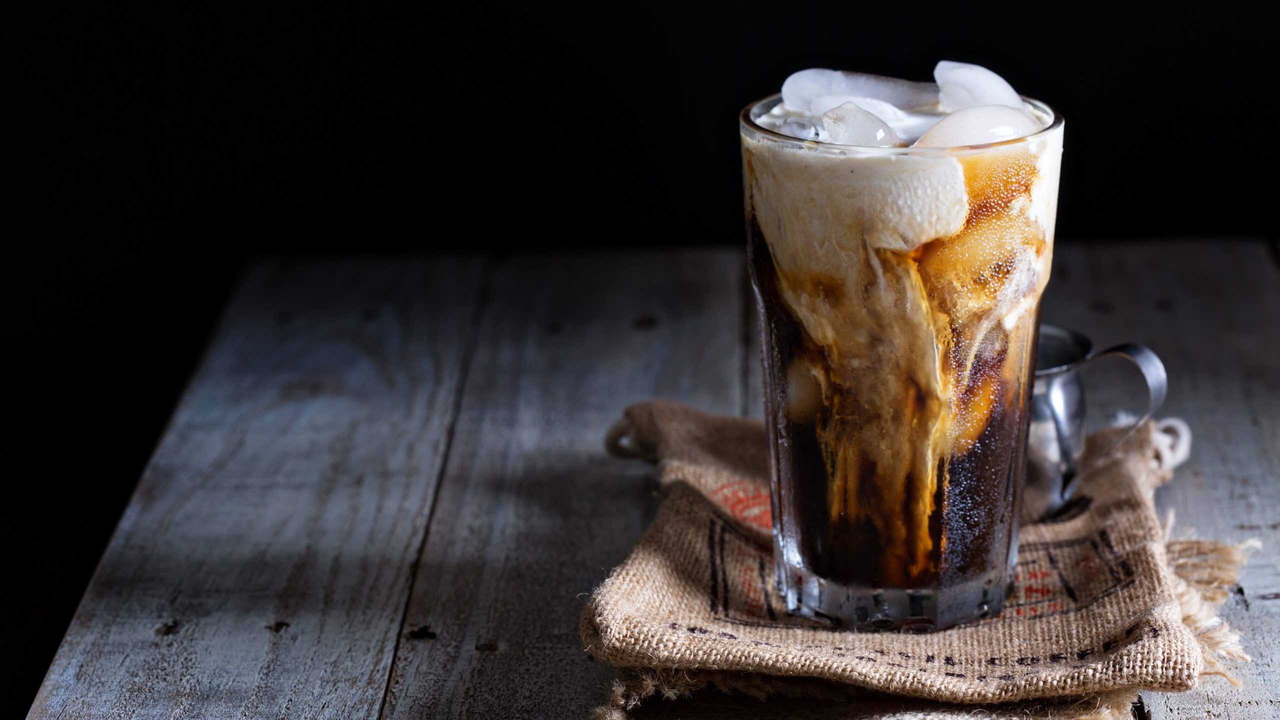 Iced coffee with cream in glass
