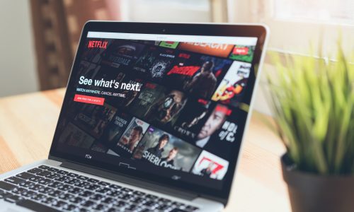 Netflix is shown on a laptop.