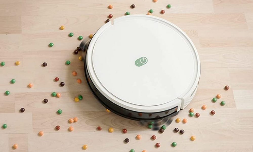 A Yeedi robot vacuum cleans up a mess.