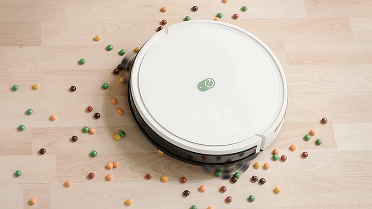 A Yeedi robot vacuum cleans up a mess.