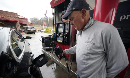 A man fills up his gas tank at a Sheetz location in Pennsylvania.