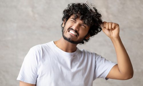 Indian man with matted curly hair