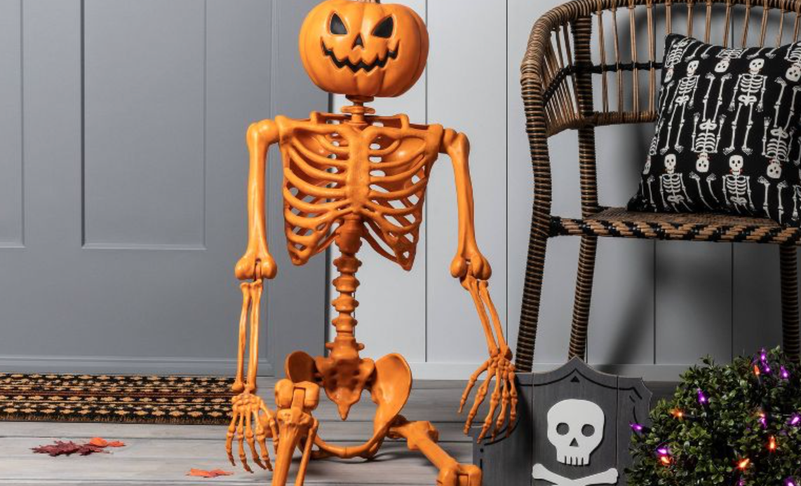 Target's orange pumpkin skeleton is shown on a porch.
