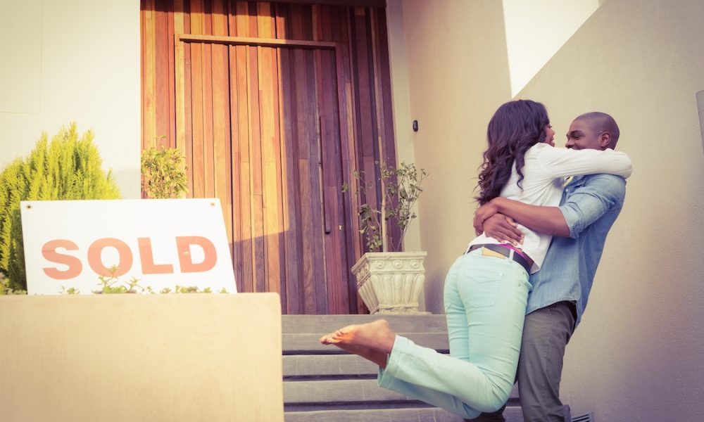 Happy african american couple after buying new house