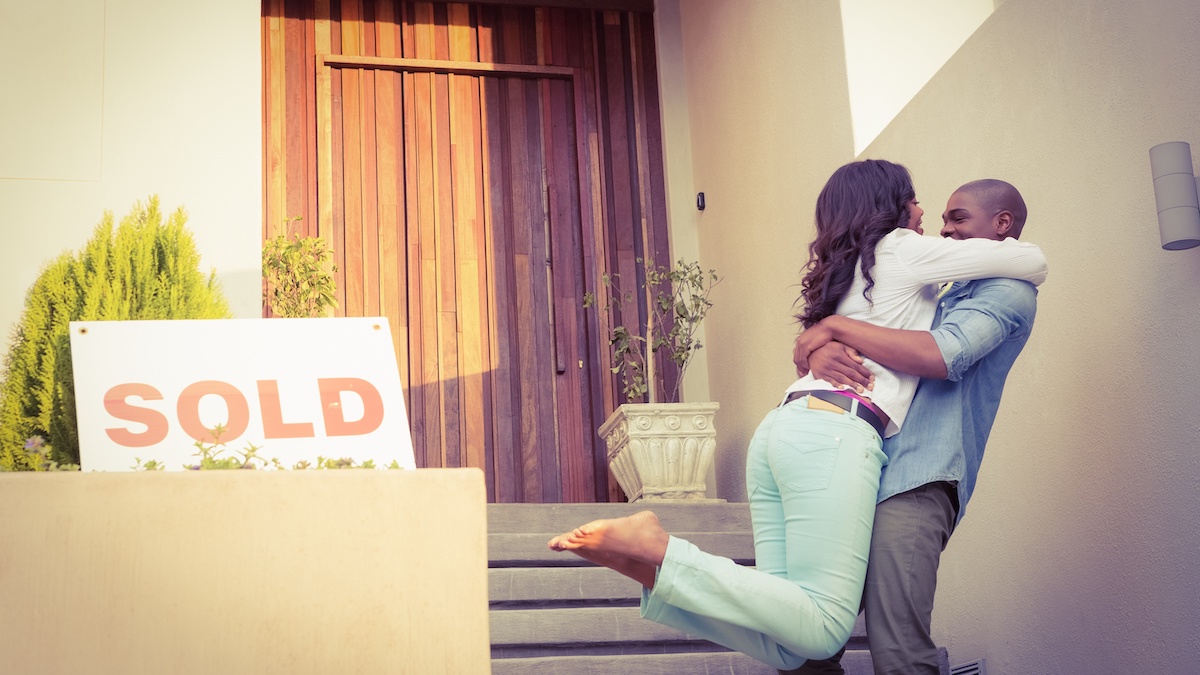 Happy african american couple after buying new house