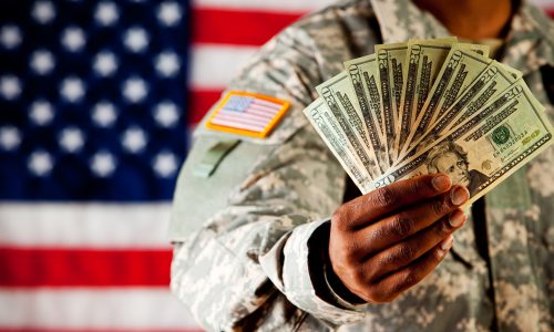 Soldier holds cash money