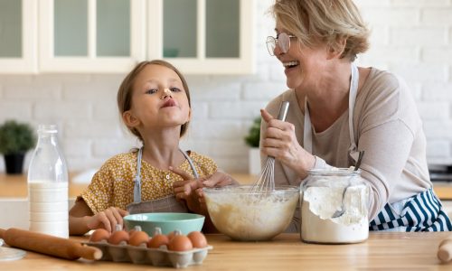Little girl and grandma in kitchen