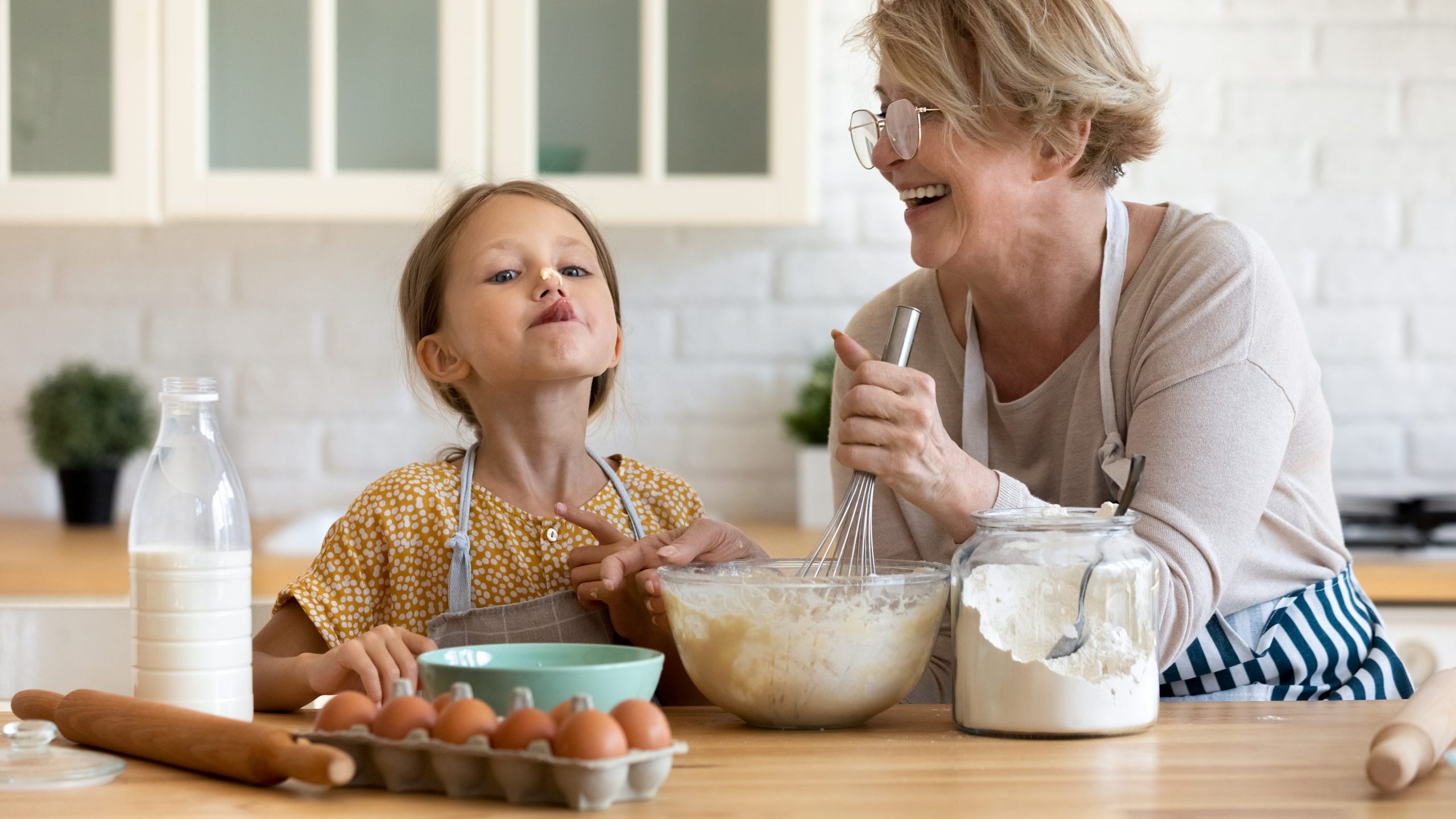 Little girl and grandma in kitchen