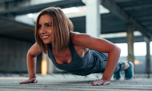 athlete woman doing push ups