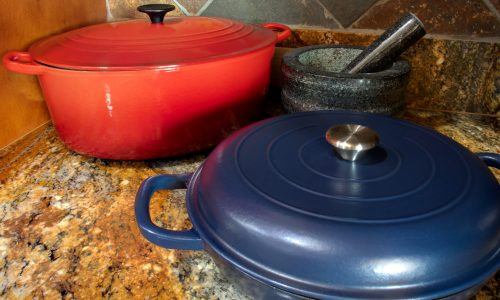 Enameled Dutch ovens, in red and blue