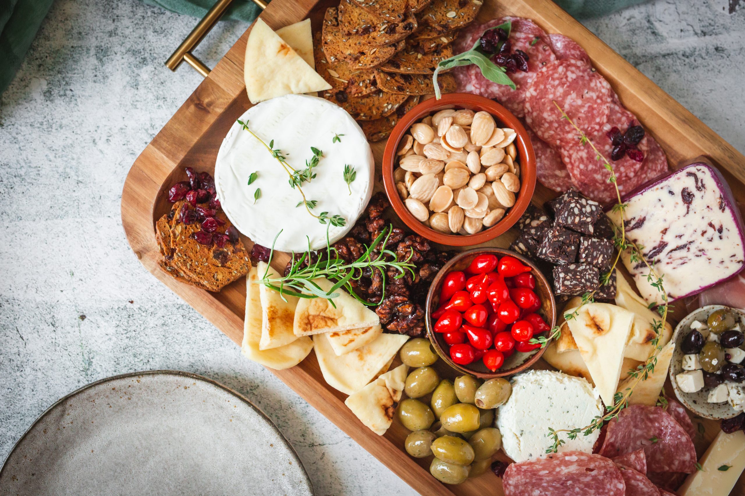 charcuterie board with small bowls