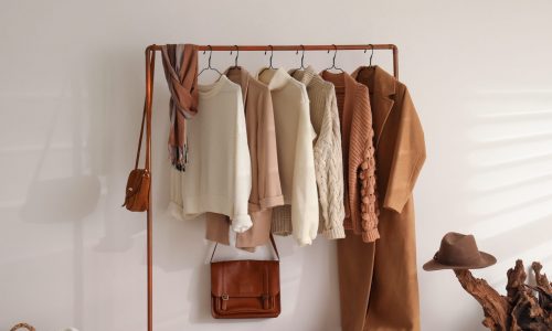clothing rack with tan clothes