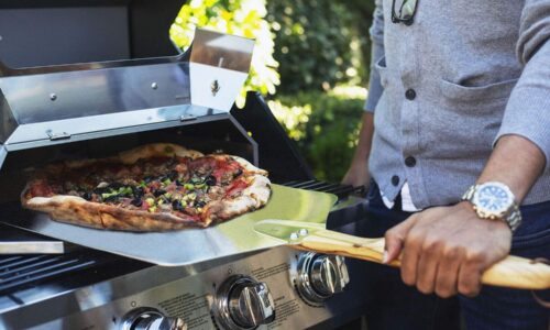 Pizza comes out of grill-top oven