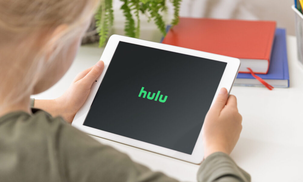 Woman watches Hulu on tablet