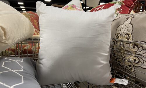 Throw pillows at Goodwill with price tags