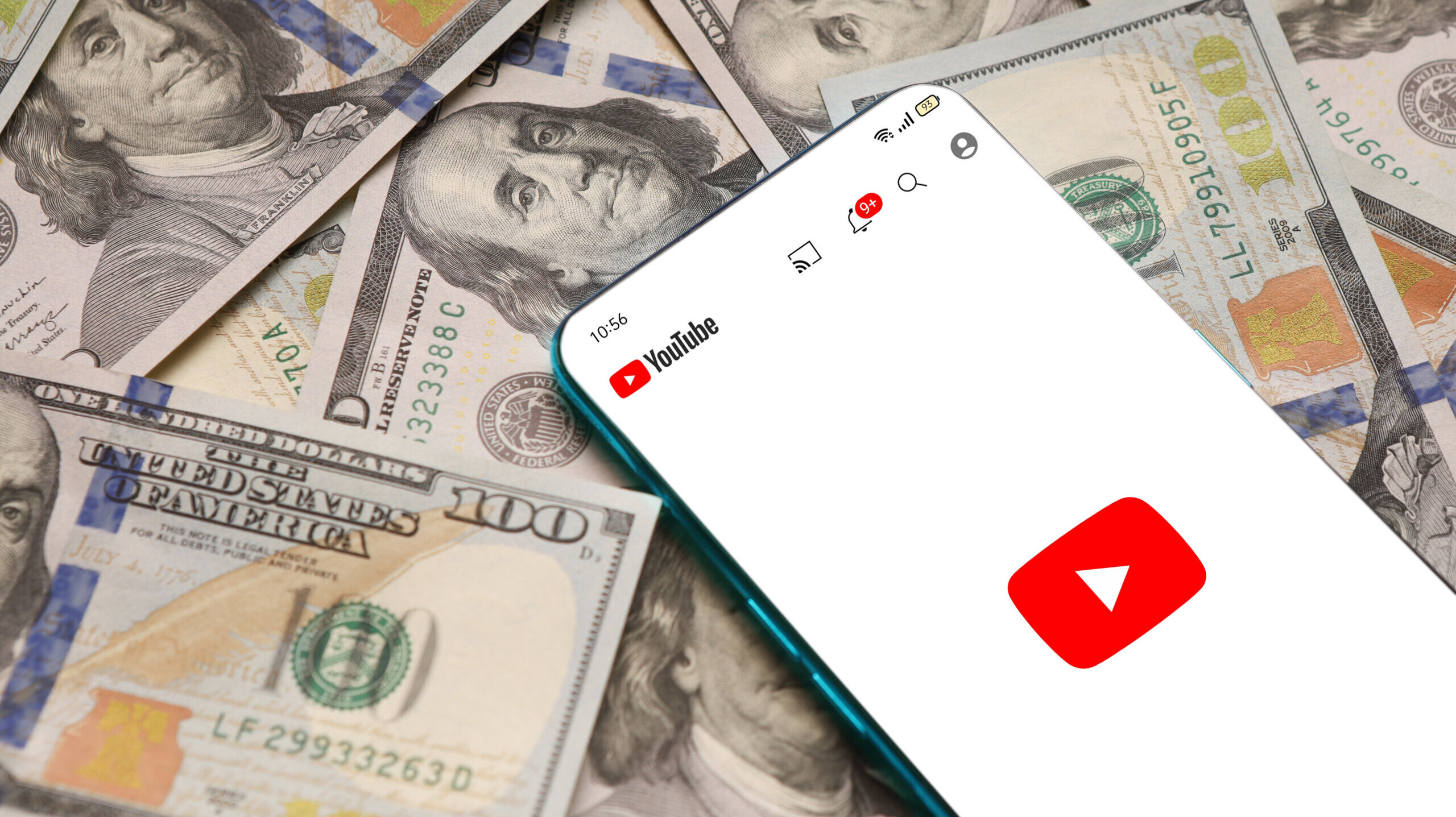 Phone with YouTube on $100 bills