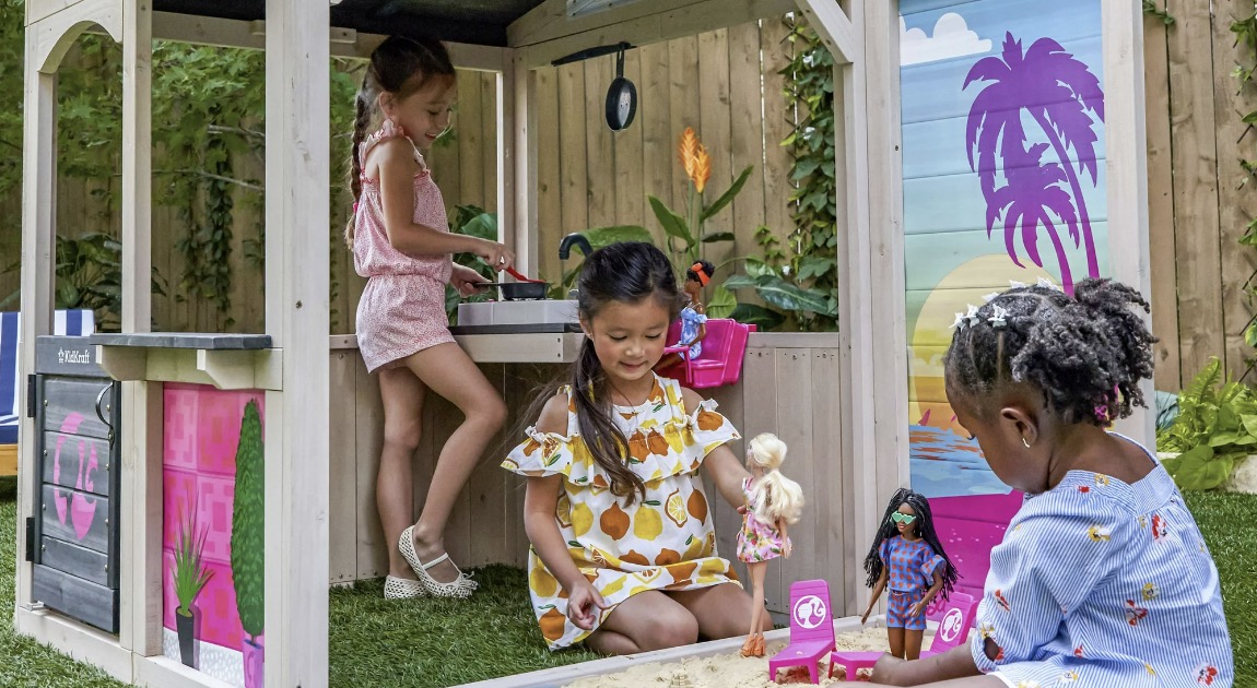 Kids play in Barbie Seaside Playhouse
