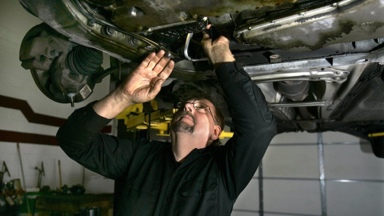 In this Nov. 30, 2007 file photo, mechanic Ed Wuerth of Wuerth Automotive in Brownstown Township, Mich., works on a Volvo at his shop. While new car owners may worry about making monthly payments in the event of a job loss, those that have had their cars for a few years may face concerns about paying for a hefty repair, especially as a vehicle nears the end of its original warranty period.