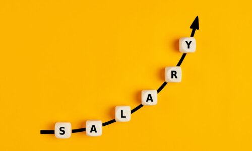 Pay raise concept: Blocks spelling 'salary' rise along arrow on yellow background