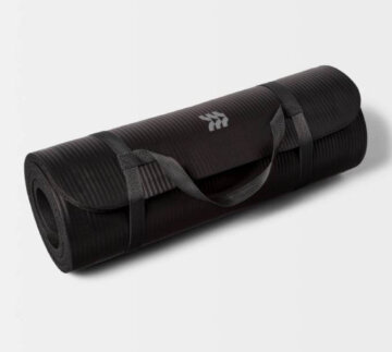A black All in Motion exercise mat that's rolled up and secured with a carrying strap