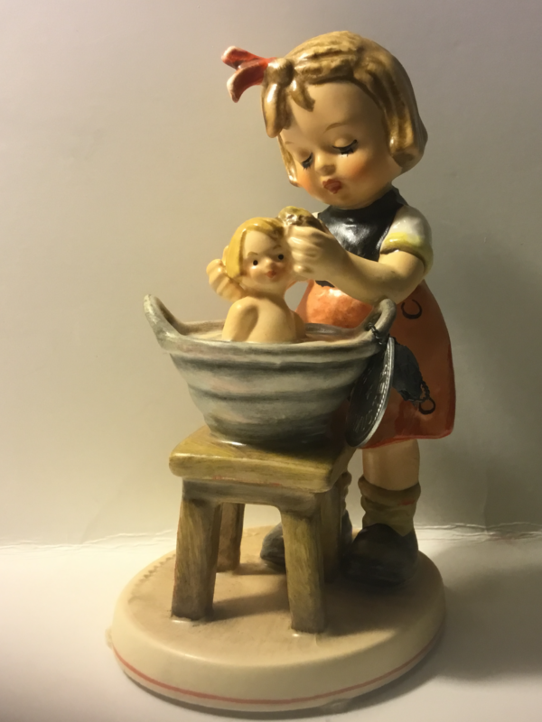 hummel figurine girl giving doll a bath