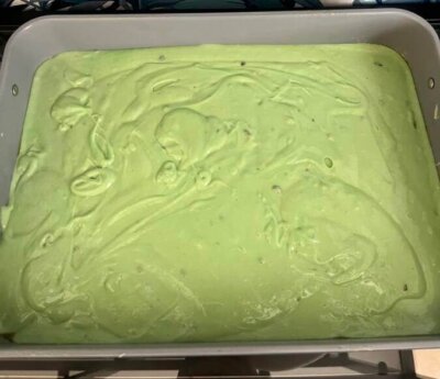 This green pistachio cake for St. Patrick's Day lifted so easily from the Caraway baking pan when it was done.